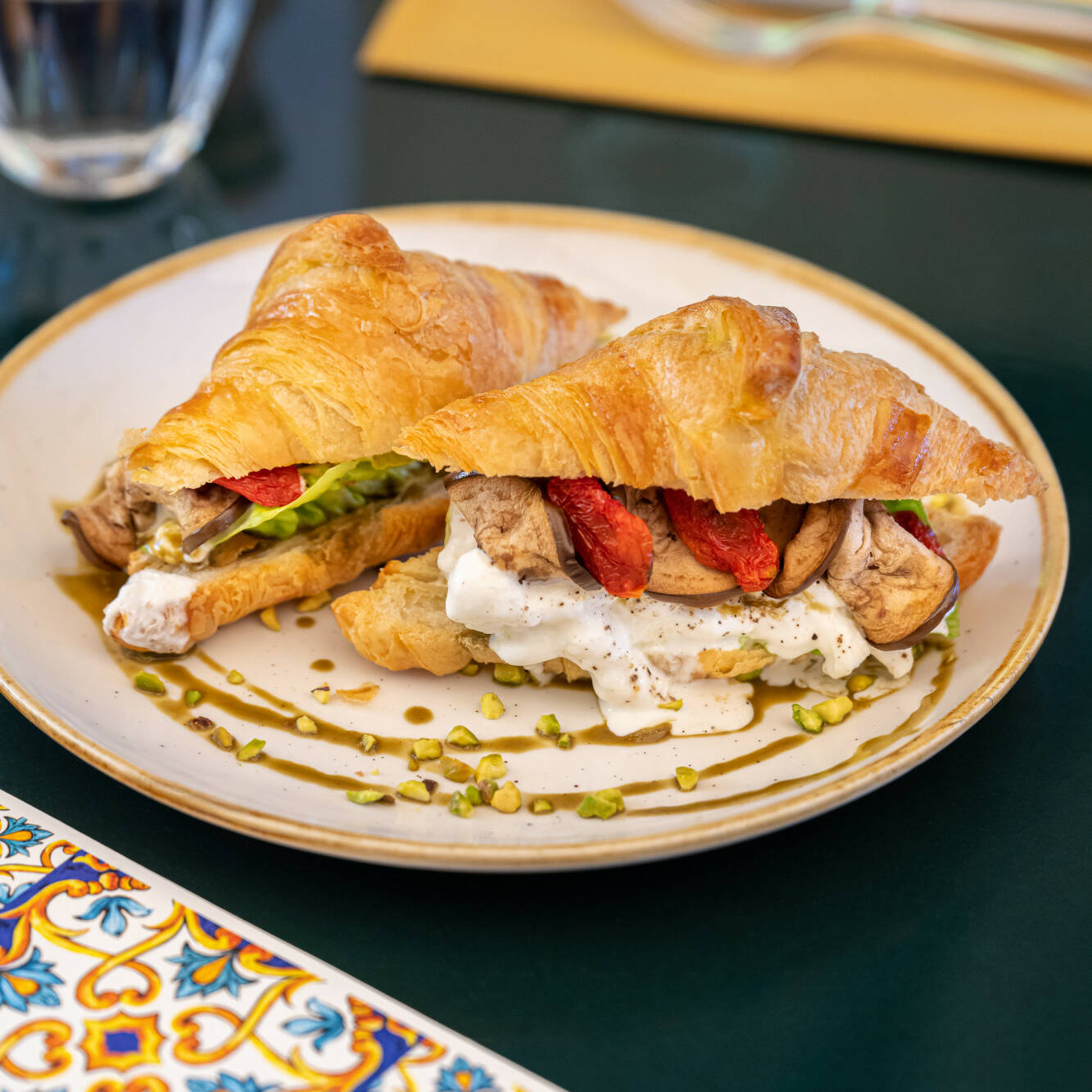 croissant brunch with stracciatella pistachio eggplant tomato